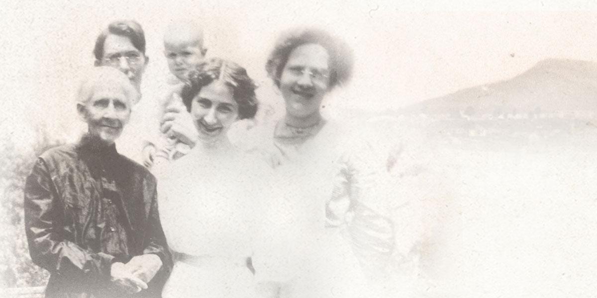 aged black and white photo of the jackson family with lookout mountain in the background